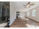 Open-concept living room with wood floors and abundant natural light at 806 Roberts Rd, Sanford, NC 27332