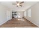 Spacious living room featuring wood floors, neutral walls, and modern ceiling fan at 806 Roberts Rd, Sanford, NC 27332