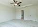 Bedroom with ceiling fan and an open doorway leading to the ensuite bathroom at 8305 Cannon Grove Dr, Willow Springs, NC 27592