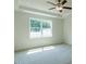 Bedroom featuring a ceiling fan and bright windows for natural light at 8305 Cannon Grove Dr, Willow Springs, NC 27592