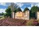 Stone sign welcoming residents to Honeycutt Landing with fresh landscaping at 8305 Cannon Grove Dr, Willow Springs, NC 27592