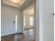 Bright foyer featuring wood floors, a double front door, and an open layout at 8305 Cannon Grove Dr, Willow Springs, NC 27592