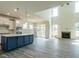 Open-concept kitchen with stainless steel appliances and a large center island at 8305 Cannon Grove Dr, Willow Springs, NC 27592