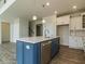 Stylish kitchen island with pendant lighting, stainless steel appliances, and plenty of storage at 8305 Cannon Grove Dr, Willow Springs, NC 27592
