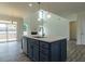 Stylish kitchen island with a sink, ample storage space, and modern fixtures at 8305 Cannon Grove Dr, Willow Springs, NC 27592