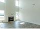 Spacious living room with a cozy fireplace and large windows for natural light at 8305 Cannon Grove Dr, Willow Springs, NC 27592