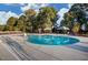 Large, inviting pool, perfect for cooling off on a hot day, with surrounding lounge area for relaxing at 8305 Cannon Grove Dr, Willow Springs, NC 27592