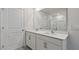 Modern bathroom with double vanity, quartz countertop, and a large mirror reflecting the bright space at 98 Ethel Ln, Angier, NC 27501