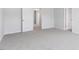 Neutral carpeted bedroom with white doors and trim, offering a blank canvas for customization at 98 Ethel Ln, Angier, NC 27501