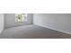 Spacious bedroom with neutral carpet and a bright window overlooking the neighborhood at 98 Ethel Ln, Angier, NC 27501