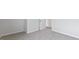 Spacious bedroom featuring neutral walls, carpet, a door, and bright lighting at 98 Ethel Ln, Angier, NC 27501