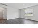 Bright bedroom with hardwood floors and a view to the neighborhood at 98 Ethel Ln, Angier, NC 27501