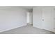A neutral bedroom featuring carpet and white paint at 98 Ethel Ln, Angier, NC 27501