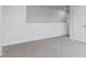 Upstairs bedroom with neutral carpet and modern architectural elements at 98 Ethel Ln, Angier, NC 27501
