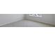 Bedroom featuring neutral carpeting, a bright window, and fresh paint at 98 Ethel Ln, Angier, NC 27501