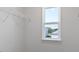 Spacious walk-in closet with wire shelving and a bright window offering natural light at 98 Ethel Ln, Angier, NC 27501