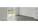 Bright dining area with wood-look floors and sliding glass doors to the backyard at 98 Ethel Ln, Angier, NC 27501