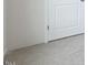 A close up view of a door, carpet, and trim at 98 Ethel Ln, Angier, NC 27501