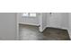 Home entryway features wood-look floors, a white front door, and views of the living area at 98 Ethel Ln, Angier, NC 27501