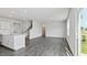 Bright living room with hardwood floors, white walls, and access to outdoor space at 98 Ethel Ln, Angier, NC 27501