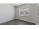 Bright office space with a large window and stylish wood-look flooring at 98 Ethel Ln, Angier, NC 27501