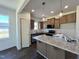 Spacious kitchen boasts granite counters and stainless steel appliances at 155 Waterwheel Dr, Selma, NC 27576