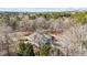 Aerial view of a charming home nestled among a forest of trees, offering privacy and seclusion at 319 Fox Hollow Dr, Clayton, NC 27527