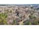 Aerial view of a beautiful home with a wooded backdrop, providing a serene and private living environment at 319 Fox Hollow Dr, Clayton, NC 27527