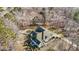 Overhead view of a home with a unique water feature, beautifully integrated into the landscape at 319 Fox Hollow Dr, Clayton, NC 27527
