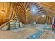 Spacious unfinished attic features exposed rafters and plywood flooring at 319 Fox Hollow Dr, Clayton, NC 27527