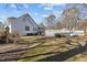 Lovely backyard featuring a deck perfect for entertaining, plus an expansive lawn at 319 Fox Hollow Dr, Clayton, NC 27527