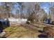 Sprawling backyard with a raised deck and mature trees provide privacy and shade at 319 Fox Hollow Dr, Clayton, NC 27527