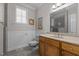 Traditional bathroom with a vanity, toilet, and window with shutters at 319 Fox Hollow Dr, Clayton, NC 27527