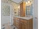 Floral bathroom with a double vanity and a glass-enclosed shower at 319 Fox Hollow Dr, Clayton, NC 27527