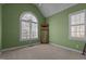 Cozy bedroom featuring an arched window, plantation shutters and neutral carpeting at 319 Fox Hollow Dr, Clayton, NC 27527