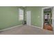 Neutral bedroom featuring carpeted floors, a window with shutters, and light green walls at 319 Fox Hollow Dr, Clayton, NC 27527