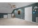 Spacious carpeted bonus room with sloped ceilings, recessed lighting, and storage at 319 Fox Hollow Dr, Clayton, NC 27527