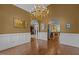 Open-concept dining room featuring hardwood floors and seamless transition to living and kitchen areas at 319 Fox Hollow Dr, Clayton, NC 27527