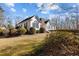 Stunning exterior elevation showcases lush landscaping and architectural details at 319 Fox Hollow Dr, Clayton, NC 27527