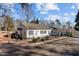 Charming one-story home with a vintage gas pump display for a unique curb appeal at 319 Fox Hollow Dr, Clayton, NC 27527