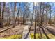 Charming gazebo nestled amongst mature trees, accessible by a winding sidewalk at 319 Fox Hollow Dr, Clayton, NC 27527