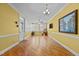 Spacious living room with plenty of natural light, hardwood floors, ceiling fan and outdoor access at 319 Fox Hollow Dr, Clayton, NC 27527