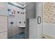 Tiled shower stall with a built-in corner seat and glass door at 319 Fox Hollow Dr, Clayton, NC 27527