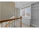 Carpeted upstairs landing with built-in shelves and a window overlooking the outdoors at 319 Fox Hollow Dr, Clayton, NC 27527