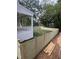 Backyard with newly installed wooden fence next to a white brick home with a porch at 3302.5 Hall Pl, Raleigh, NC 27607