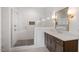 Gorgeous bathroom featuring glass-enclosed shower and vanity with modern fixtures and stone countertop at 3302.5 Hall Pl, Raleigh, NC 27607