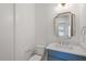 Modern bathroom with a vanity, a stylish mirror, and a commode with sleek fixtures at 3302.5 Hall Pl, Raleigh, NC 27607