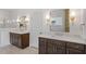 Elegant bathroom featuring double vanities with marble countertops, modern fixtures and mirrors at 3302.5 Hall Pl, Raleigh, NC 27607