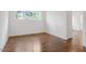 Bedroom boasts windows, hardwood flooring, and neutral paint at 3302.5 Hall Pl, Raleigh, NC 27607