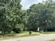 Inviting entrance to a green space with meticulously maintained landscaping, offering a serene escape at 3302.5 Hall Pl, Raleigh, NC 27607